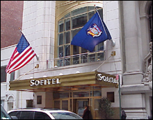 The U.S. and New York State flags adorn the entrance to the Sofitel Hotel in midtown Manhattan after French flags were removed from hotel properties in the United States.
