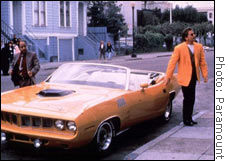 This 1970 Plymouth 'Cuda -- show here with Don Johnson (right) as Nash Bridges and Cheech Marin as Joe Dominguez -- sold for $148,000.