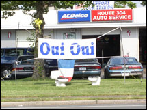 Have Americans really forgiven the French? The French flag hangs over toilet bowls outside a car repair shop in New York. (From: CNN/Money)