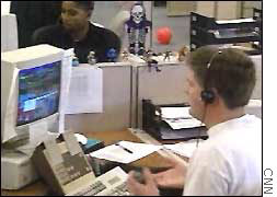 Workers at a telemarketing firm place calls to consumers.