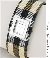 Shoppers are picking up pricey gifts like this $295 Burberry signature check cuff.