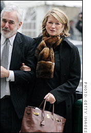 One hand on her lawyer, the other on her Birkin