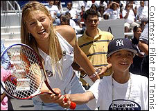 Sharapova giving a tennis clinic before a recent tournament.