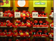 A row of Elmo dolls wait patiently for eager buyers at the Toys 