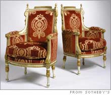 A pair of Italian gilt armchairs from Dennis Kozlowski's apartment.
