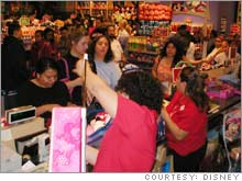 Customers checking out at The Disney Store in Glendale, Calif.