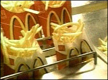 McDonald's has upped its estimates for the trans fat in its french fries by one-third, according to a published report.