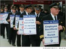 Pilots at Delta Air Lines, shown here on an informational picket line, could be on strike in a little more than a week, according to its union.