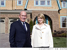 Stewart with KB Home CEO Bruce Karatz in front of one of the designs inspired by her own homes.