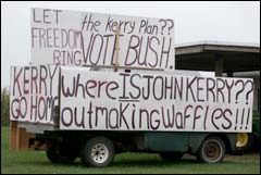 A Hamptons, NY resident criticizes Senator John Kerry with homemade signs.