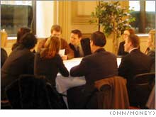 Groups of 10 sat around tables to engage in 