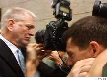 Ebbers, on his way to be sentenced Wednesday morning, pushed a photographer out of his way.
