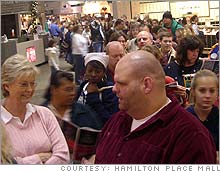 Shoppers crowd the Hamilton Place mall in Chattanooga, Tenn., early Friday.