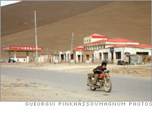 A young man on a motorcycle near Lhasa.